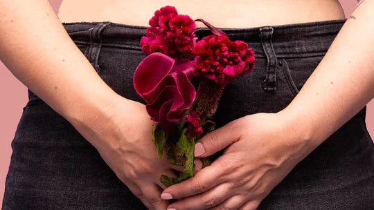 red flowers held over private area